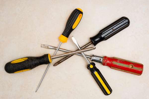 Using A Screwdriver To Unlock A Bedroom Door